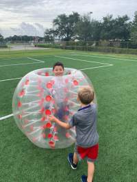 Boy playing on the soccer field 