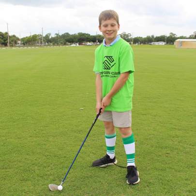 Boy holding golf club 