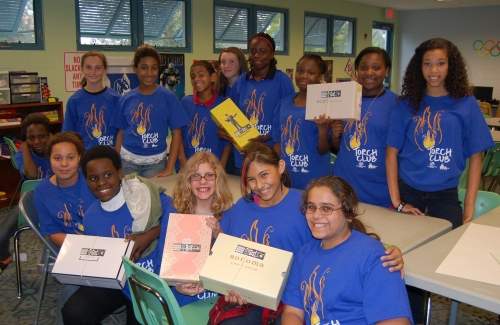 Torch club kids wearing their blue shirts smiling